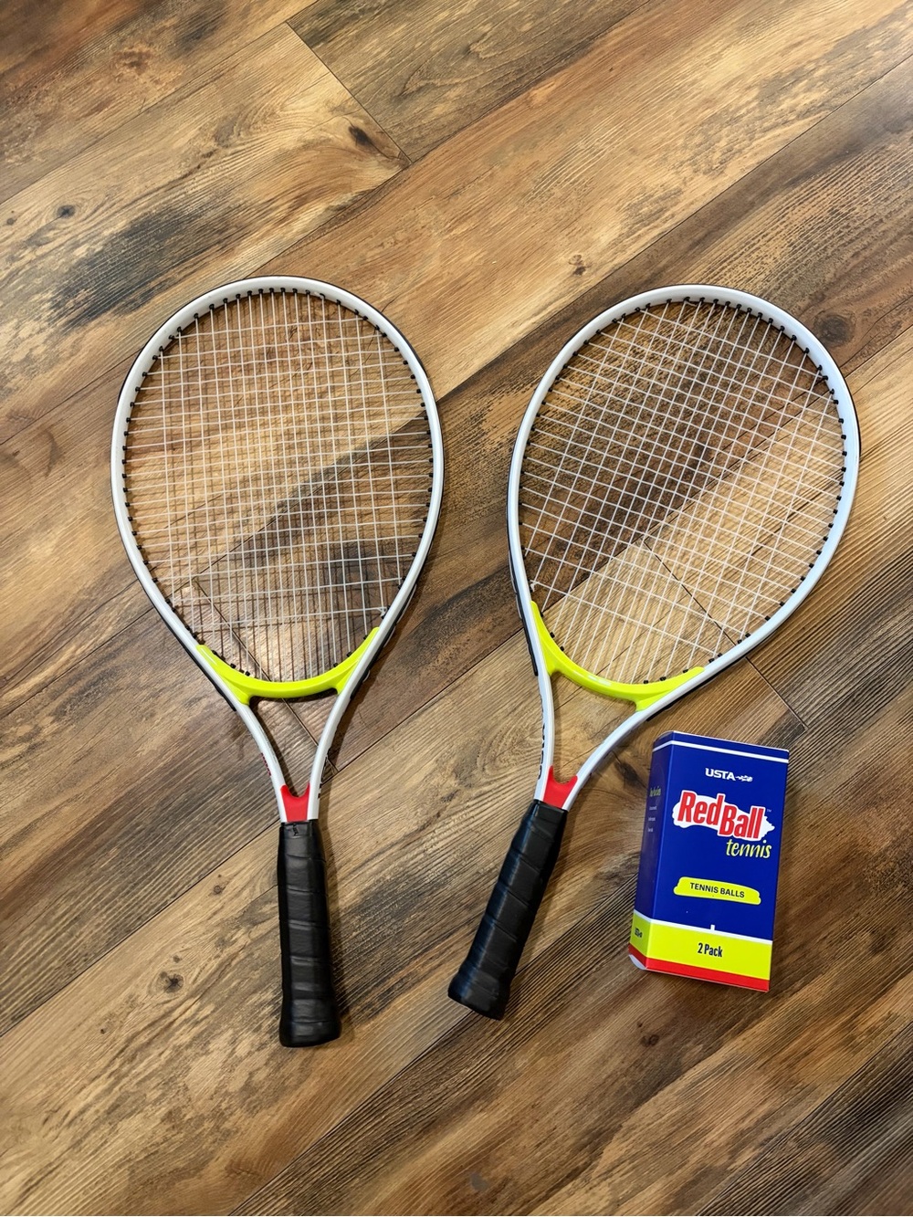 Pair of Yellow and White Men’s Tennis Rackets with Black Grips